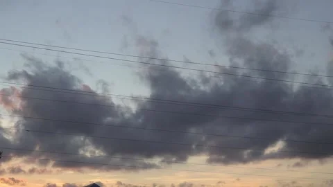 Dark rain clouds floating in summer sunset on warm evening twilight, gray Stock Footage 163185528