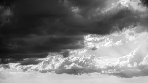 Dark rain clouds gathering for a storm, creating a dramatic and moody scene. Stock Photos
