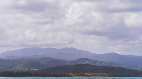 Dark rain clouds hang over the mountains of El Junque Rain Forest in Puerto Rico Stock Photos