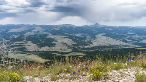 Dark rain clouds moving across Montana landscape mountains Stock Footage 167538410
