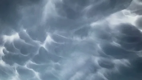 Dark rain clouds quickly run across the sky before the storm Stock Footage