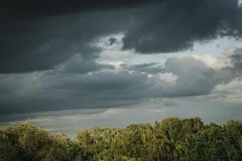 Dark rain clouds, thunderstorm. Soft selective focus. Stock Photos