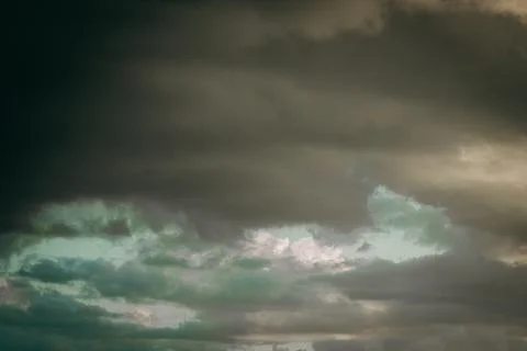 Dark rain clouds, thunderstorm. Soft selective focus. 写真素材