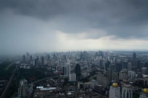 Dark raining cloud over the city, Bangkok Cityscape Stock Photos