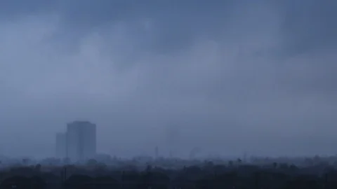 Dark rainstorm passing through city - time lapse Stock-Footage 87754555