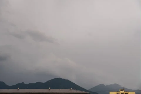 Dark, rainy clouds above mountains, timelpase Stock Footage 277079174