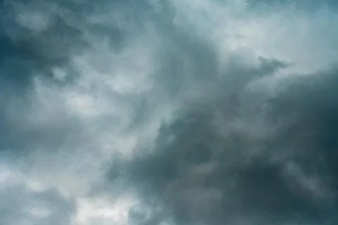 Dark rainy clouds covered sky before storm. Stock Photos