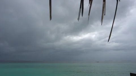 Dark rainy clouds over the ocean. Islands. Video stock 291678367