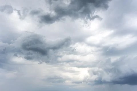 Dark rainy clouds with some lighter and darker parts Stock Photos