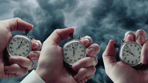 Dark rainy sky and hands with stopwatches Stock Footage 236478691