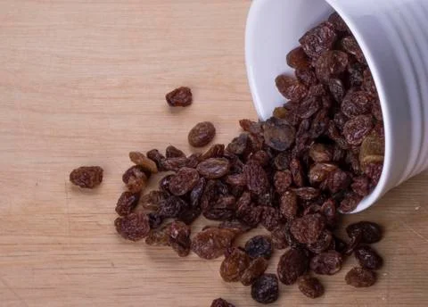 Dark raisins on a table Stock Photos