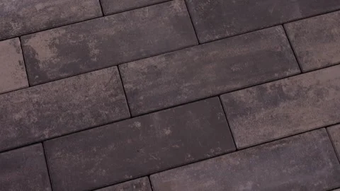 Dark rectangular paving stones arranged in modern walkway pattern 스톡 동영상 343691368