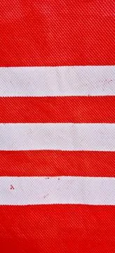 Dark red background with broken white lines. Stock Photos