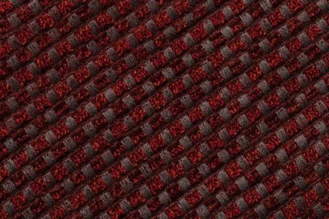 Dark red background from checkered pattern textile, closeup. Structure of the Stock Photos