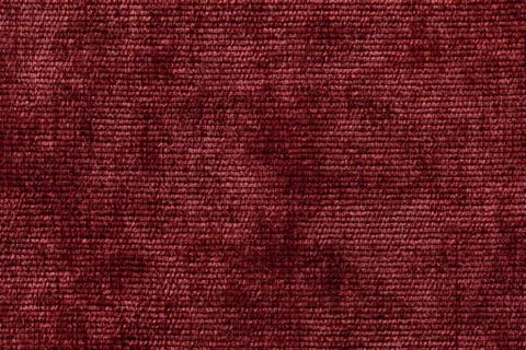 Dark red background from soft textile material. Fabric with natural texture. Stock Photos