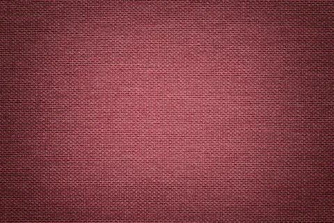 Dark red background from a textile material. Fabric with natural texture. Bac Stock Photos