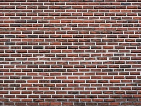 Dark red brick wall as a background texture Stock Photos