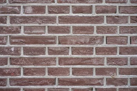 Dark red brick wall background Stock Photos