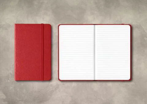 Dark red closed and open lined notebooks on concrete background Stock Photos