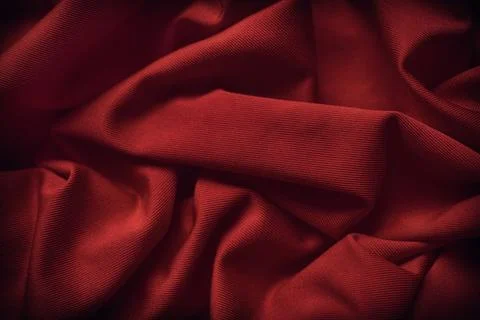 A dark red fabric texture background. Close up. Stock Photos