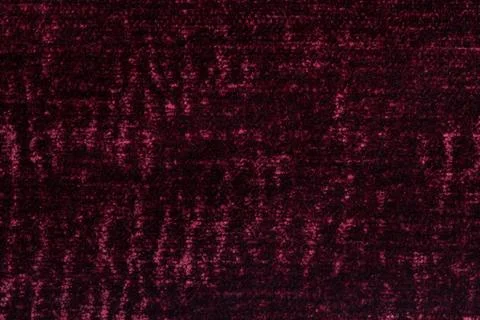 Dark red fluffy background of soft, fleecy cloth. Texture of textile closeup Stock Photos