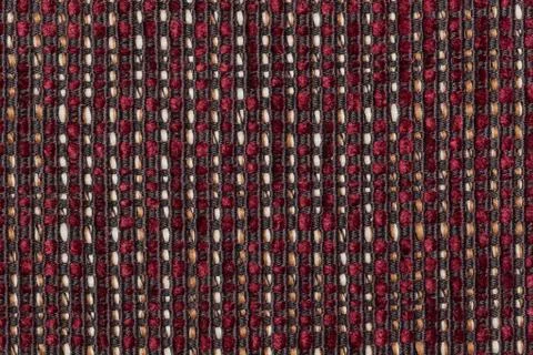 Dark red fur on a black strings base with thick white and golden strings Stock Photos