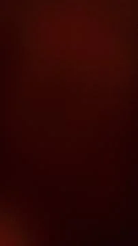 Dark red grainy abstract background vertical texture with subtle gradient a.. Stock Photos