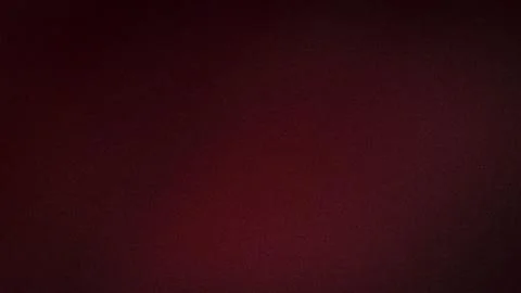 Dark red grainy texture with black shades and smooth gradient background 4K.. Stock Photos