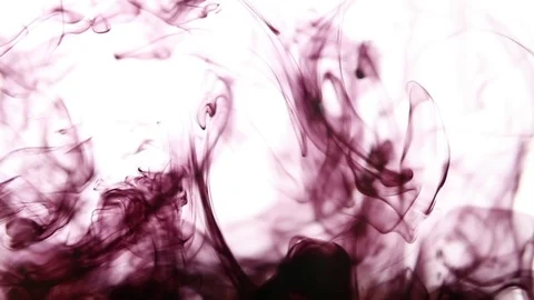 Dark red ink dissolves in clear water Stock Footage 73479857