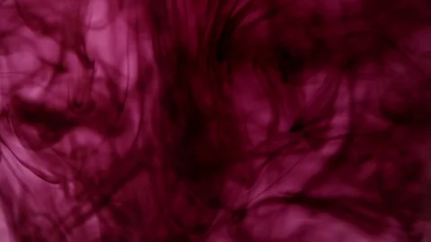 Dark red ink mixed with clear water Stock Footage 73479704