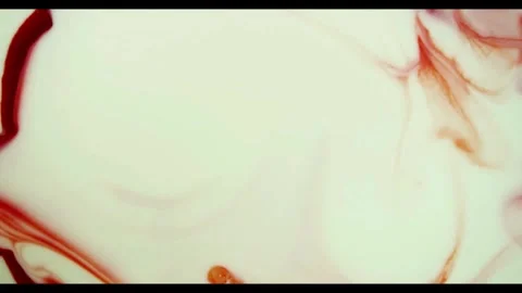 Dark red ink spreading quickly inside white liquid base 動画素材 329754427