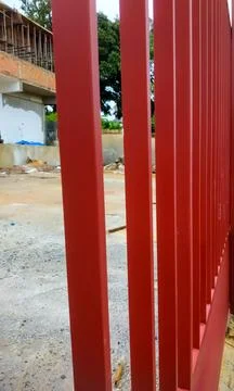 Dark red iron gate object, in the shop building construction area Stock Photos