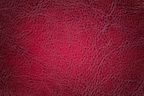 Dark red leather texture background, closeup. Ruby cracked backdrop from wrin Stock Photos