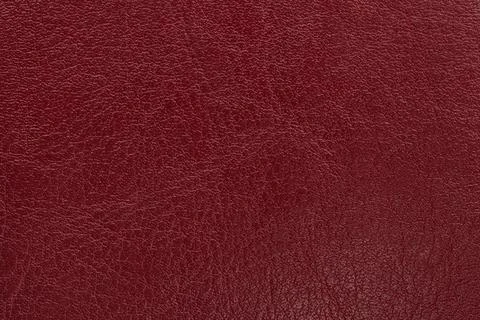 Dark red leather texture background. Closeup photo. Foto stock