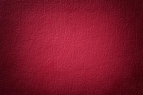 Dark red leather texture background. Closeup photo. Stock Photos