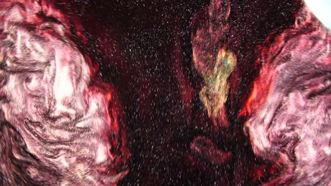Dark red liquid with sparkles and pearly shine. abstract background. Slow motion Stock Footage 118620093