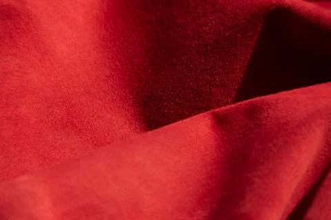 Dark red matte background of suede fabric, closeup. Velvet texture of seamles 写真素材