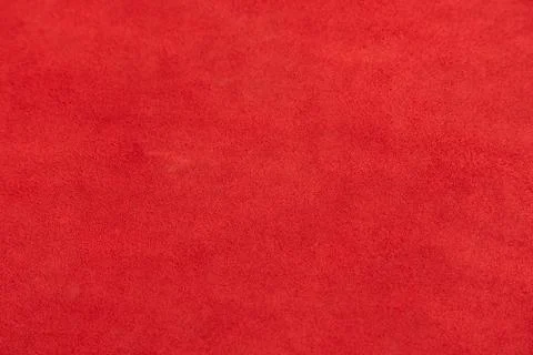 Dark red matte background of suede fabric, closeup. Velvet texture of seamles Foto stock
