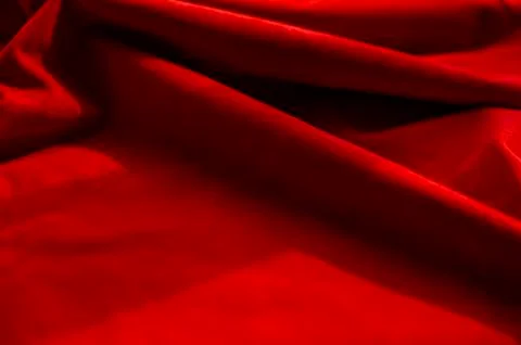 Dark red matte background of suede fabric, closeup. Velvet texture of seamles Foto stock