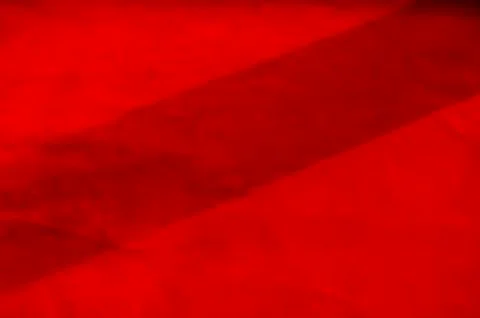 Dark red matte background of suede fabric, closeup. Velvet texture of seamles 스톡 사진