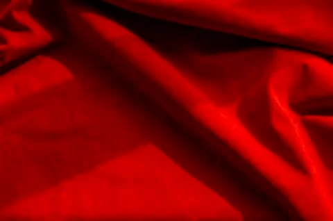 Dark red matte background of suede fabric, closeup. Velvet texture of seamles Foto stock