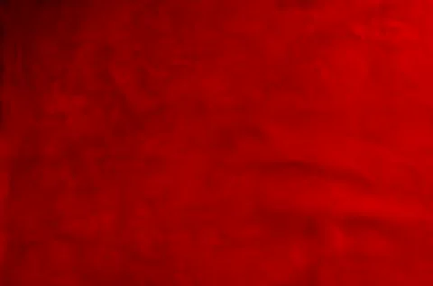 Dark red matte background of suede fabric, closeup. Velvet texture of seamles 写真素材