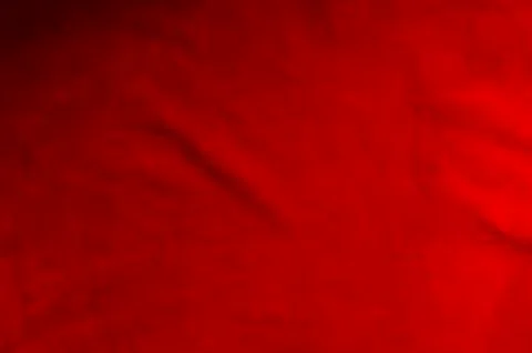 Dark red matte background of suede fabric, closeup. Velvet texture of seamles Foto stock