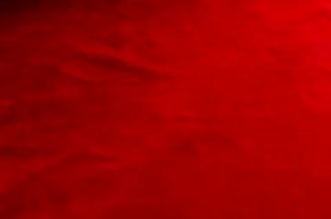 Dark red matte background of suede fabric, closeup. Velvet texture of seamles Foto stock