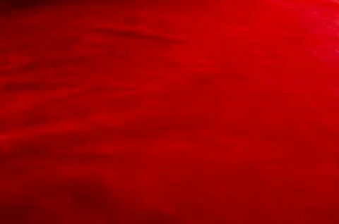 Dark red matte background of suede fabric, closeup. Velvet texture of seamles Foto stock