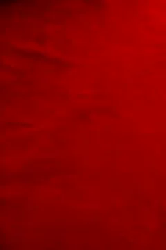 Dark red matte background of suede fabric, closeup. Velvet texture of seamles Foto stock