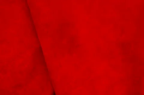 Dark red matte background of suede fabric, closeup. Velvet texture of seamles 写真素材