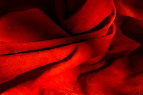 Dark red matte background of suede fabric, closeup. Velvet texture of seamles 스톡 사진