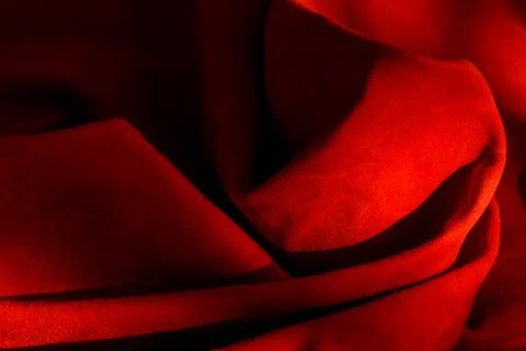Dark red matte background of suede fabric, closeup. Velvet texture of seamles Foto stock