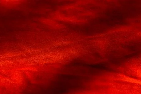 Dark red matte background of suede fabric, closeup. Velvet texture of seamles 스톡 사진